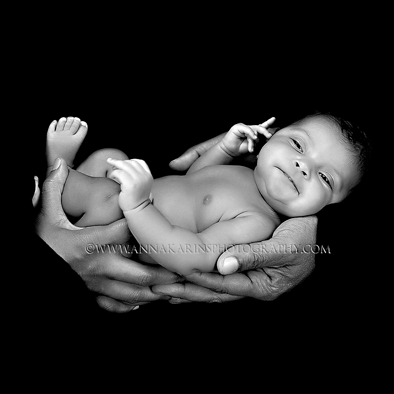 African American newborn baby in South Louisiana, baby in her parents hands, timeless gorgeous portraits 