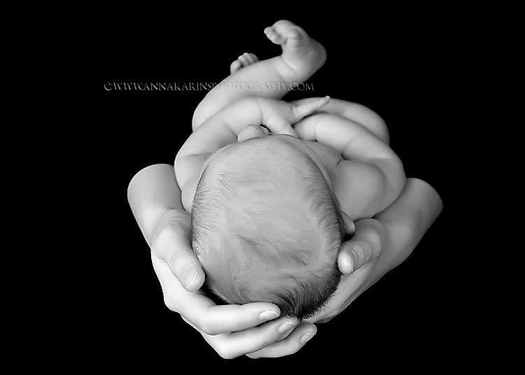 Newborn baby in mothers arms, contemporary modern baby and child portraits