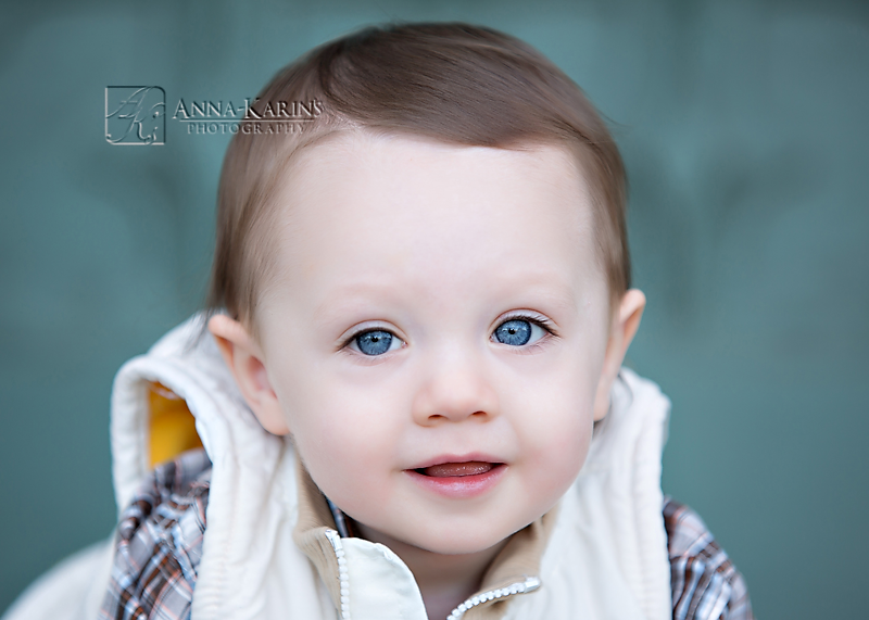 Beautiful blue eyes on little boy, toddler boy with blue eyes. Outdoor session with little boy and blue eyes