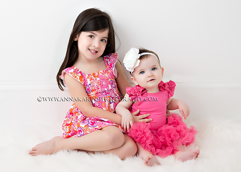Little sisters dressed in pink