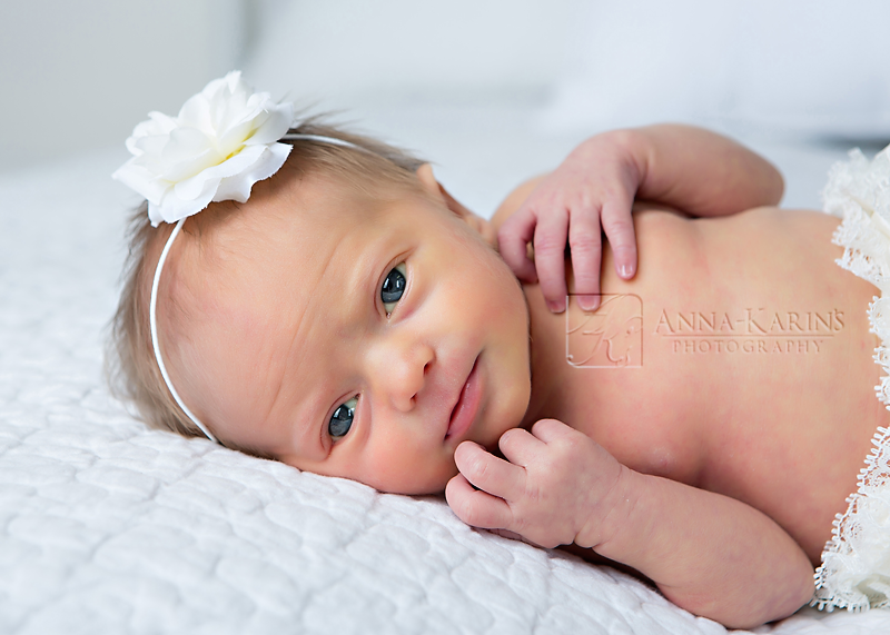 Alert blue eyed newborn baby girl