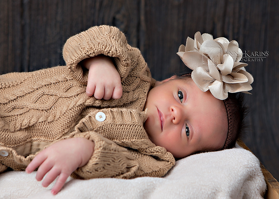 Newborn baby girl with brown headband