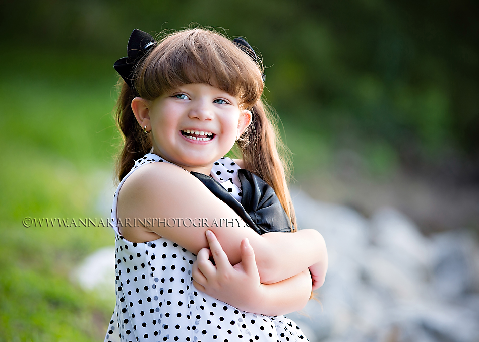 happy little girl in outdoor portrait